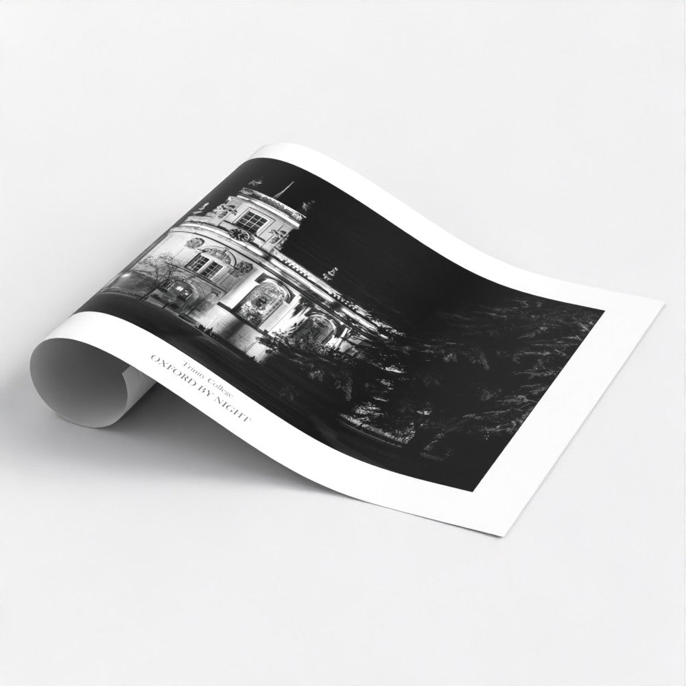 Evocative B&W art poster print showcasing the floodlit architecture of Trinity College Oxford under the cover of darkness. A mesmerizing black and white image highlighting the architectural details of this historic college.