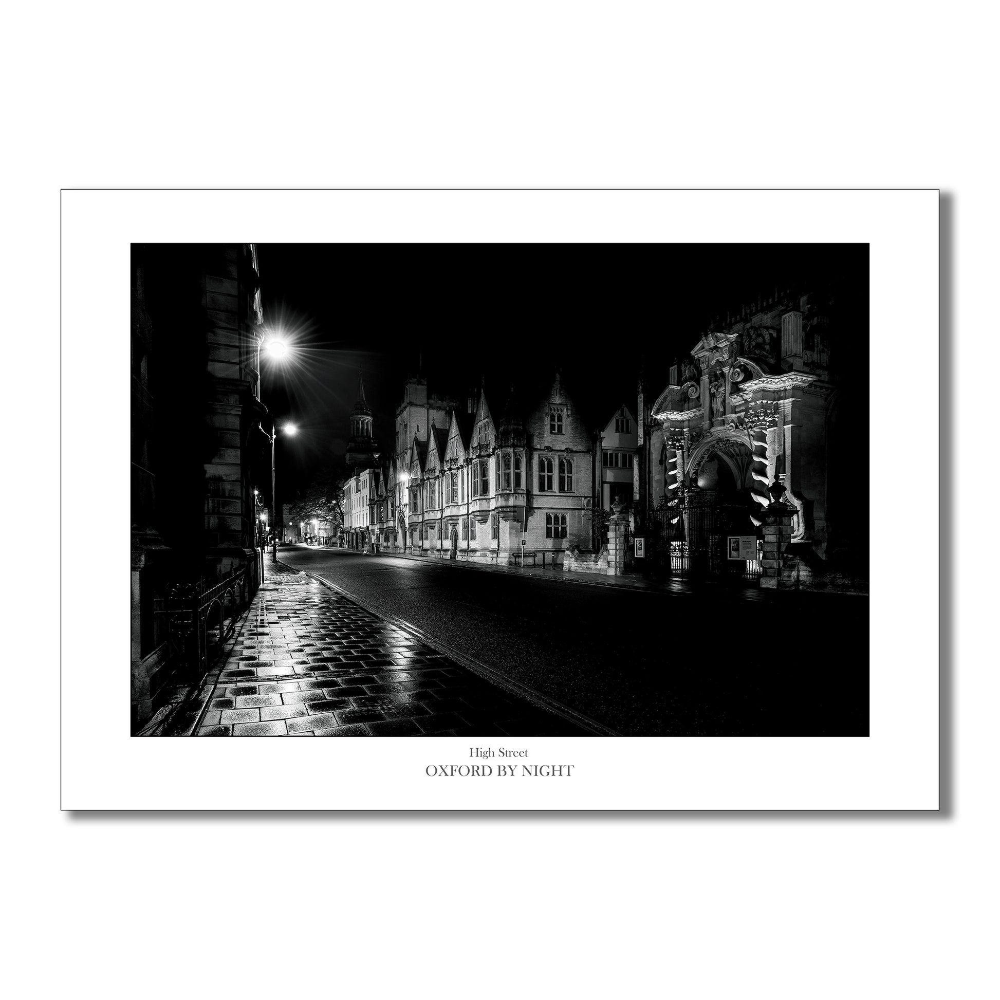 Unique B&W art print showcasing the deserted Oxford High street under the cover of darkness. A mesmerizing black and white image highlighting the architectural details of this historic city.