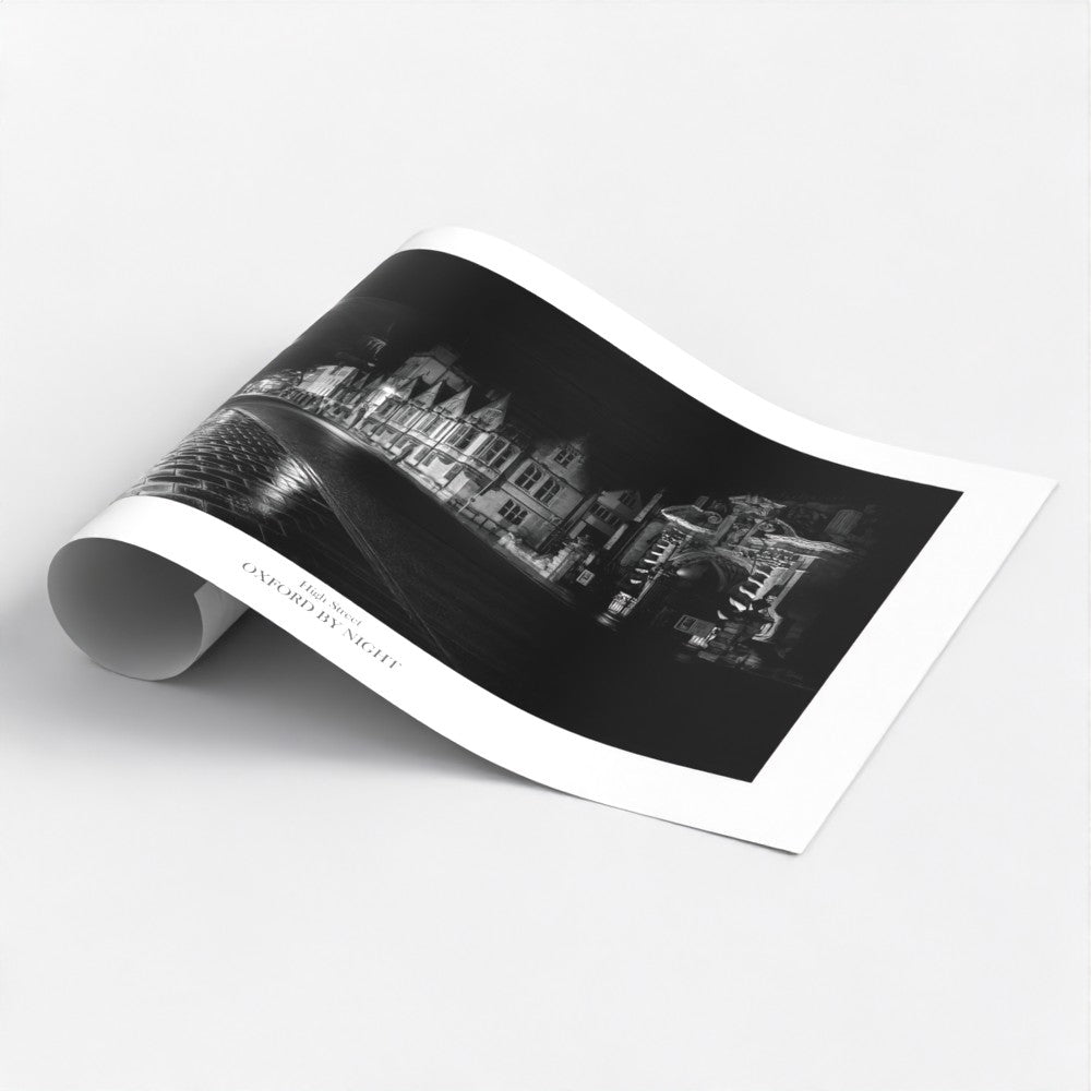 Unique B&W art poster print showcasing the deserted Oxford High street under the cover of darkness. A mesmerizing black and white image highlighting the architectural details of this historic city.